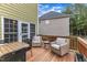 Inviting back deck features a dining table with chairs and comfortable seating area for outdoor living at 1237 Shirehall Park Ln, Wake Forest, NC 27587