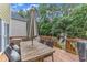 Outdoor back deck dining and backyard playset provides an inviting backyard entertainment space at 1237 Shirehall Park Ln, Wake Forest, NC 27587