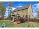 Spacious backyard with multilevel deck, lawn and green exterior offers great outdoor opportunities at 1237 Shirehall Park Ln, Wake Forest, NC 27587