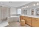 Bright bathroom features a shower, soaking tub, and double vanity at 1237 Shirehall Park Ln, Wake Forest, NC 27587