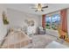 Cozy bedroom featuring a large window and a playful giraffe at 1237 Shirehall Park Ln, Wake Forest, NC 27587