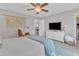 Spacious bedroom with a comfortable bed, a cozy chair, and ample storage, creating a relaxing retreat at 1237 Shirehall Park Ln, Wake Forest, NC 27587
