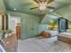 This bedroom features an accent wall, two beds, and bright windows at 1237 Shirehall Park Ln, Wake Forest, NC 27587