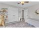 Comfortable bedroom features custom shelving, lots of light and space at 1237 Shirehall Park Ln, Wake Forest, NC 27587