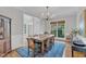 Elegant dining room with hardwood floors, natural light, and classic chandelier at 1237 Shirehall Park Ln, Wake Forest, NC 27587