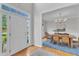 Bright foyer leading to dining room, featuring hardwood floors and natural light at 1237 Shirehall Park Ln, Wake Forest, NC 27587
