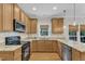 Beautiful kitchen featuring granite countertops, stainless steel appliances, and wood cabinets at 1237 Shirehall Park Ln, Wake Forest, NC 27587
