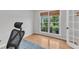 Bright office featuring a view of the landscaped backyard through a large, sunny window at 1237 Shirehall Park Ln, Wake Forest, NC 27587