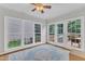 Sunroom bathed in light, featuring large windows and doors leading to a patio at 1237 Shirehall Park Ln, Wake Forest, NC 27587