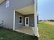 A cozy back porch offers a serene outdoor space for relaxing and entertaining at 128 Bruce Dr, Dunn, NC 28334