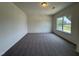 A carpeted bedroom featuring a neutral color palette and a window view at 128 Bruce Dr, Dunn, NC 28334