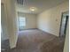 Comfortable bedroom with neutral carpet, a window, and fresh paint at 128 Bruce Dr, Dunn, NC 28334