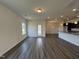 Bright and airy living room with wood-look floors and an open layout connecting to the kitchen at 128 Bruce Dr, Dunn, NC 28334