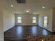 Bright living room with a back door entrance and views to the windows showcasing the property at 128 Bruce Dr, Dunn, NC 28334