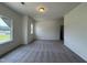 Spacious living room with plush carpeting and ample natural light at 128 Bruce Dr, Dunn, NC 28334