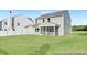 Home exterior showcasing a screened porch and a well-maintained backyard at 140 Benson Village Dr # 83, Benson, NC 27504