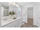 Bathroom featuring double sinks, modern fixtures, and an open doorway to the walk-in closet at 140 Benson Village Dr # 83, Benson, NC 27504