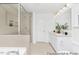 Stylish bathroom featuring a glass shower, soaking tub, and dual sink vanity at 140 Benson Village Dr # 83, Benson, NC 27504
