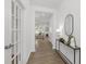 Entryway features a view into the living room, hardwood flooring, and a decorative console table at 140 Benson Village Dr # 83, Benson, NC 27504