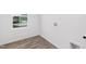 Laundry room with vinyl flooring, neutral walls, window with views and utility connections at 140 Benson Village Dr # 83, Benson, NC 27504