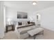 Main bedroom with carpet flooring, upholstered bed, and dual bedside tables at 140 Benson Village Dr # 83, Benson, NC 27504