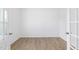 Empty office space with wood-look flooring and double doors for privacy at 140 Benson Village Dr # 83, Benson, NC 27504