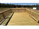 Outdoor back deck with wood railing overlooking backyard with plenty of land at 140 Brookhaven Dr, Spring Hope, NC 27882