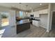 Beautiful kitchen featuring stainless appliances, gray countertop island, and hardwood floors at 140 Brookhaven Dr, Spring Hope, NC 27882