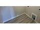 Bright laundry area with gray vinyl flooring, modern trim work, and laundry connections at 140 Brookhaven Dr, Spring Hope, NC 27882
