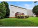 Spacious backyard featuring a wooden deck and lush green lawn, perfect for outdoor activities and relaxation at 1405 Merrilow Ct, Wake Forest, NC 27587
