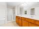 Bathroom features a double sink vanity, separate shower and soaking tub at 1405 Merrilow Ct, Wake Forest, NC 27587