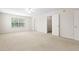 Large bedroom provides neutral carpet, a ceiling fan and access to a closet at 1405 Merrilow Ct, Wake Forest, NC 27587