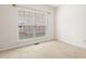 Bedroom featuring carpet and large window at 1405 Merrilow Ct, Wake Forest, NC 27587