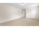 Bedroom featuring neutral carpet, light walls, closet with sliding doors, and a door to another room at 1405 Merrilow Ct, Wake Forest, NC 27587