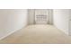 Bright bedroom features neutral carpet, white trim and a window for natural light at 1405 Merrilow Ct, Wake Forest, NC 27587