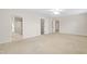 Spacious bedroom with neutral carpet, ceiling fan, and access to bath at 1405 Merrilow Ct, Wake Forest, NC 27587
