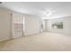 Expansive bedroom offers three windows, neutral carpet and a ceiling fan at 1405 Merrilow Ct, Wake Forest, NC 27587