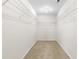 Walk-in closet features built-in wire shelving to maximize storage space at 1405 Merrilow Ct, Wake Forest, NC 27587