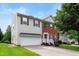 Charming two-story home with a two-car garage, well-maintained lawn, and inviting curb appeal at 1405 Merrilow Ct, Wake Forest, NC 27587