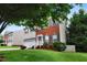 Attractive two-story home featuring a brick facade, shutters, and a well-kept lawn with mature trees at 1405 Merrilow Ct, Wake Forest, NC 27587