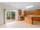 Open floor plan with a kitchen featuring stainless steel appliances, tile floors, and island at 1405 Merrilow Ct, Wake Forest, NC 27587