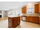 Modern kitchen featuring an island, stainless steel appliances, and abundant cabinetry for storage, overlooking the living room at 1405 Merrilow Ct, Wake Forest, NC 27587
