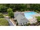 Aerial view of community pool, clubhouse, and playground, showcasing a fun and Gathering-friendly amenity at 1405 Merrilow Ct, Wake Forest, NC 27587