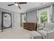 Bedroom boasts a large dresser, accent chair and natural light from the windows at 1501 Chatsworth Ln, Raleigh, NC 27614