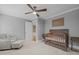 Bedroom with crib, chair, and ceiling fan, perfect for a growing Gathering at 1501 Chatsworth Ln, Raleigh, NC 27614