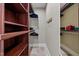 Walk-in closet with wooden shelving, hanging racks, and ample storage space at 1501 Chatsworth Ln, Raleigh, NC 27614