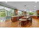 Spacious kitchen featuring hardwood floors, custom cabinetry, and a large island with counter seating at 1501 Chatsworth Ln, Raleigh, NC 27614