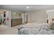 Spacious main bedroom featuring plush carpeting, and two closets at 1501 Chatsworth Ln, Raleigh, NC 27614
