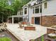 Outdoor kitchen features a built-in grill, pizza oven and bar top for a luxury outdoor dining experience at 1501 Chatsworth Ln, Raleigh, NC 27614