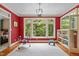 Play room featuring a large window with natural views, a built-in bookshelf, and hardwood floors at 1501 Chatsworth Ln, Raleigh, NC 27614